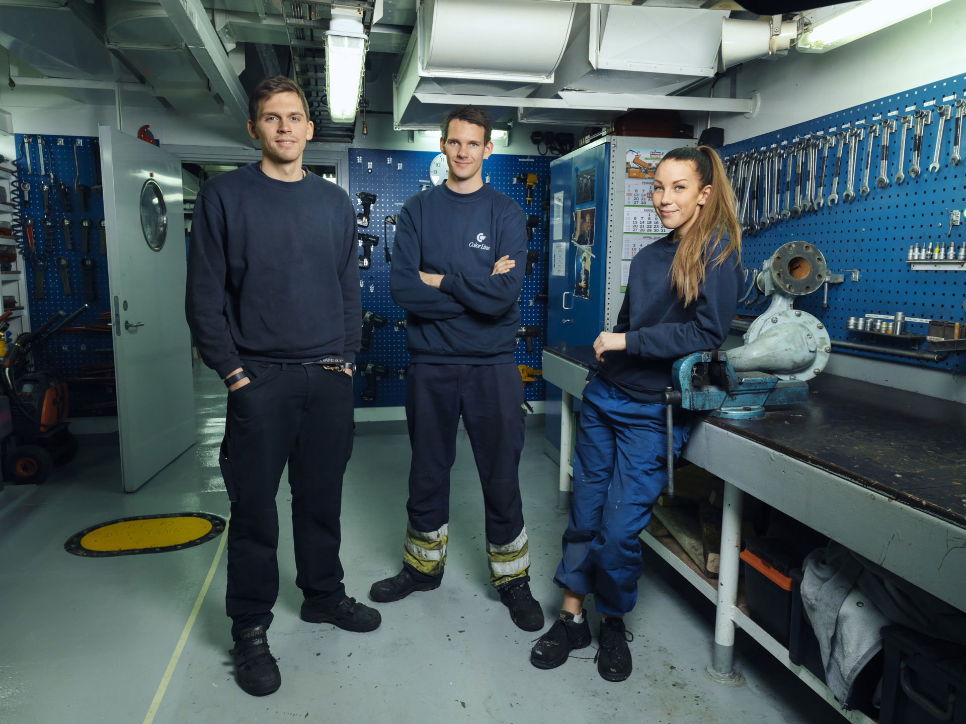 alt="color line employees in the machine department on board color magic "