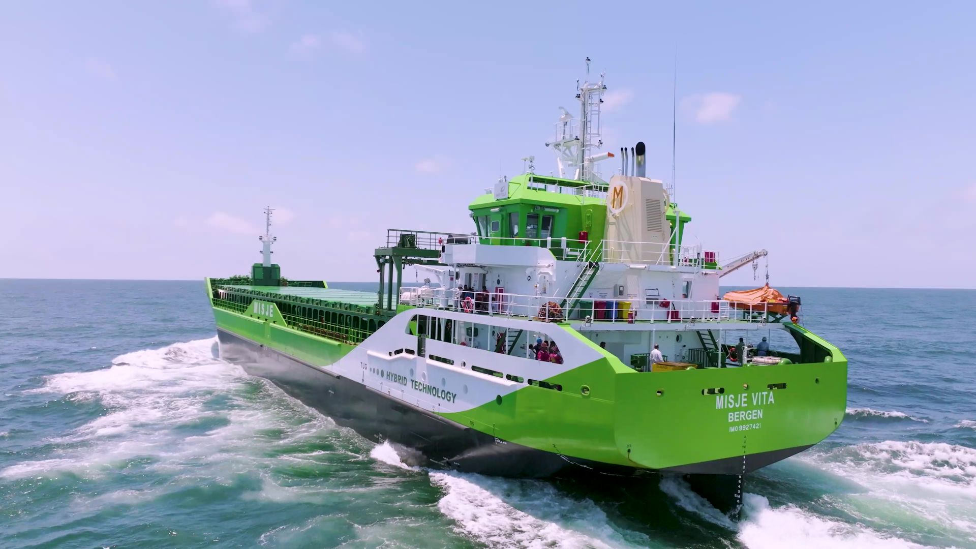 alt="the green eco bulker misje vita on blue sea with clear skies "
